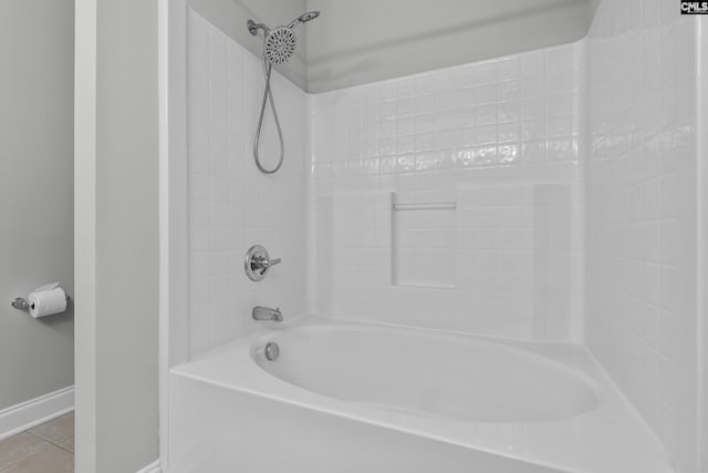 full bathroom featuring shower / bath combination, baseboards, and tile patterned flooring