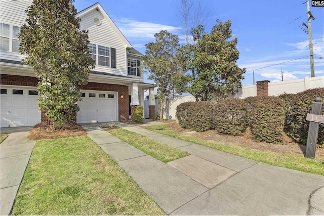 view of front facade with concrete driveway, an attached garage, and brick siding