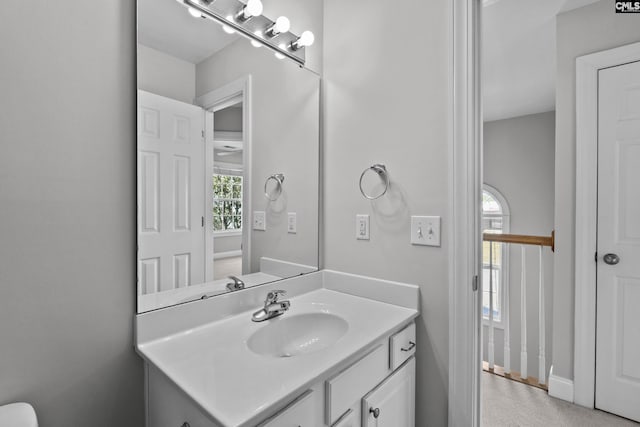 bathroom with a healthy amount of sunlight and vanity