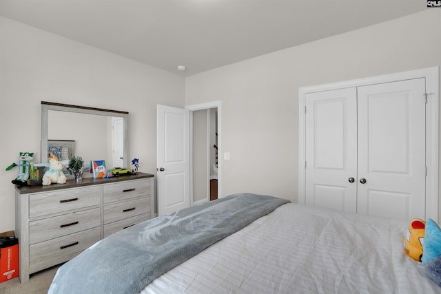 bedroom featuring a closet and carpet flooring