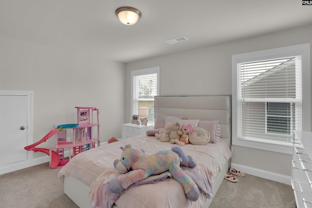 bedroom featuring carpet, visible vents, and baseboards