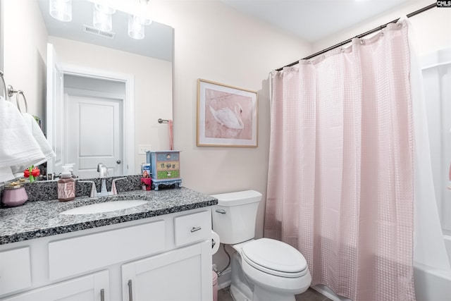 bathroom featuring shower / bathtub combination with curtain, toilet, visible vents, and vanity