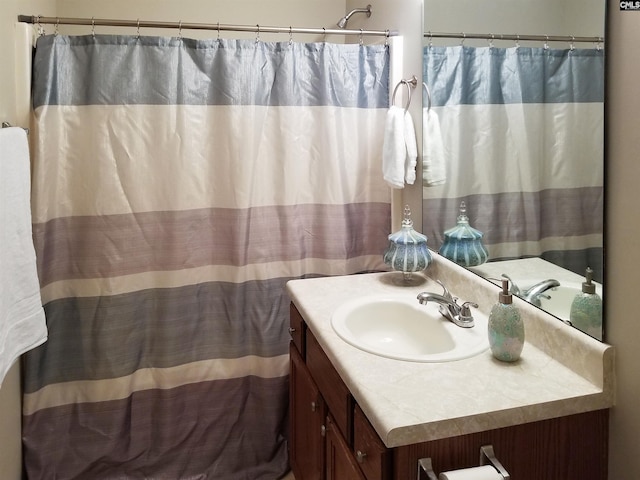 bathroom with vanity and curtained shower