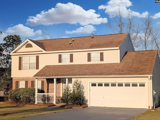 traditional-style house featuring aphalt driveway, covered porch, a front yard, and roof with shingles