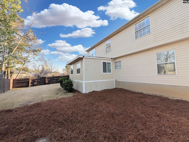 back of house featuring a fenced backyard