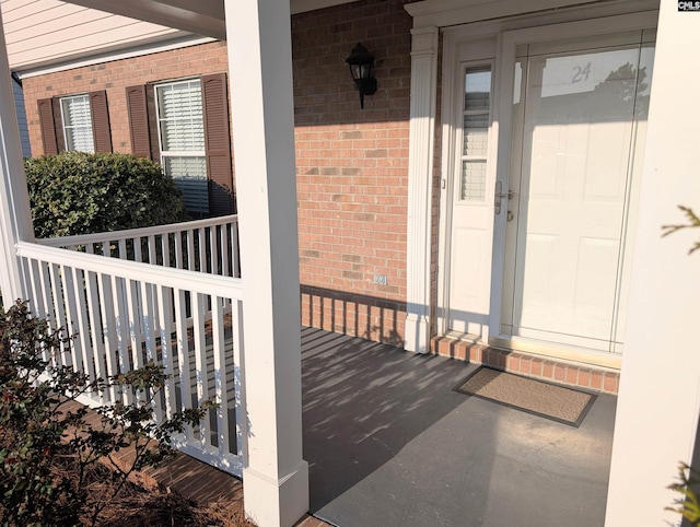 property entrance with brick siding