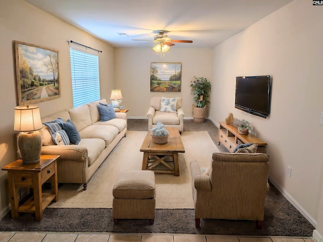 tiled living room featuring visible vents, baseboards, and ceiling fan