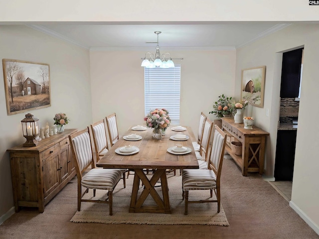 dining space featuring light carpet, a notable chandelier, baseboards, and ornamental molding