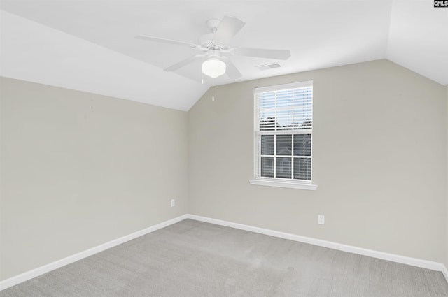 additional living space featuring vaulted ceiling, baseboards, and visible vents