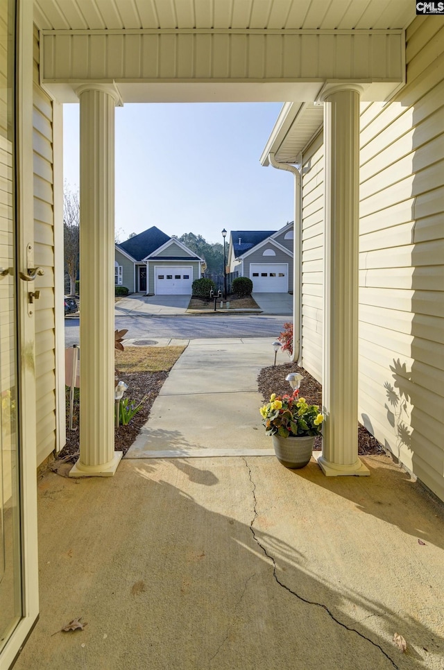 view of patio / terrace featuring concrete driveway