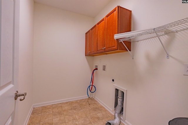 laundry area with baseboards, washer hookup, hookup for a gas dryer, cabinet space, and hookup for an electric dryer