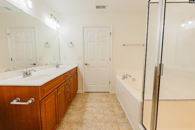 full bathroom featuring tile patterned floors, a shower stall, a garden tub, and a sink