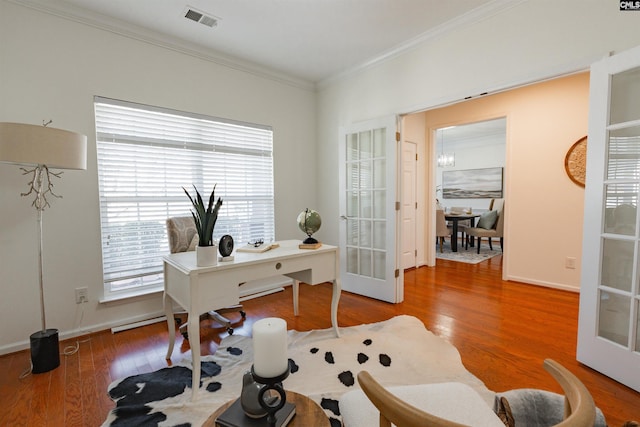 office area with visible vents, baseboards, ornamental molding, french doors, and wood finished floors