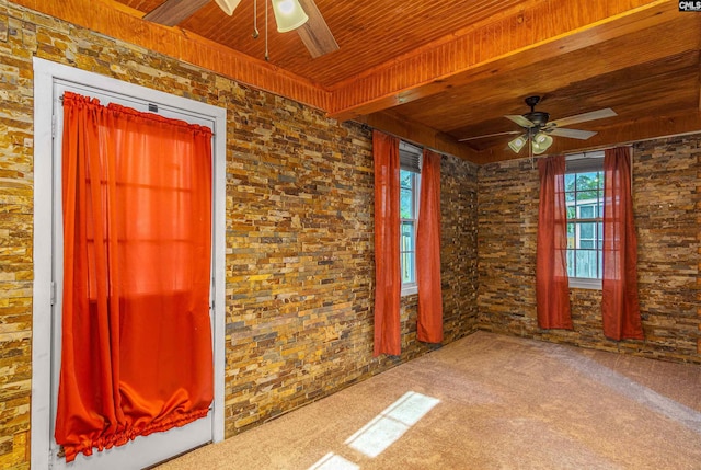 spare room featuring wooden ceiling, visible vents, carpet floors, and ceiling fan