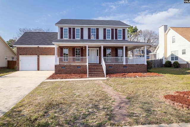 colonial home featuring fence, driveway, a porch, a front lawn, and a garage