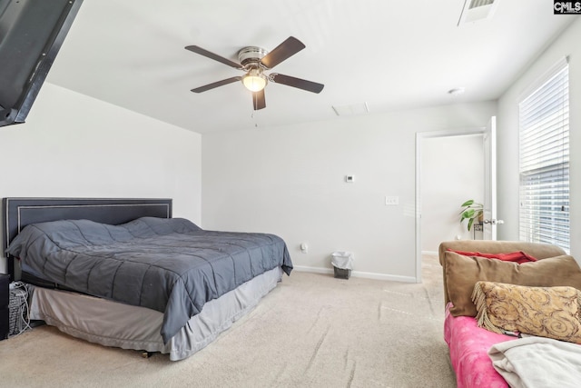 bedroom with carpet flooring, baseboards, visible vents, and ceiling fan