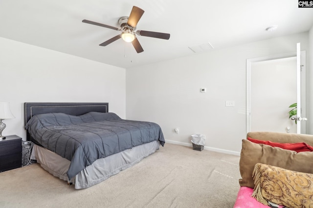 carpeted bedroom with baseboards and ceiling fan