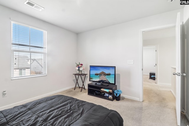 bedroom with visible vents, multiple windows, and baseboards