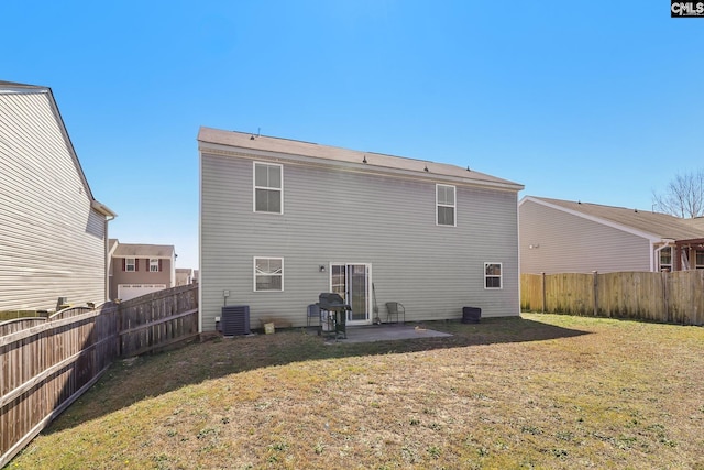 back of house featuring a patio area, central air condition unit, a lawn, and a fenced backyard