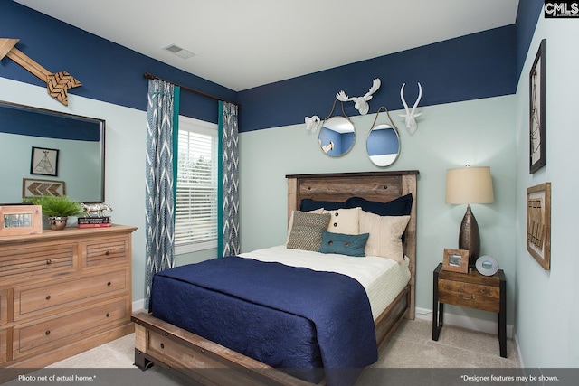 bedroom with visible vents, baseboards, and carpet