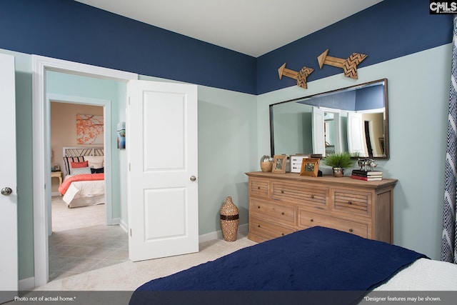 carpeted bedroom with baseboards