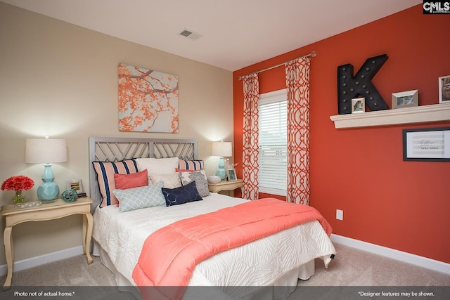 bedroom with visible vents, baseboards, and carpet flooring