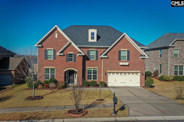 view of front facade featuring a front lawn and brick siding