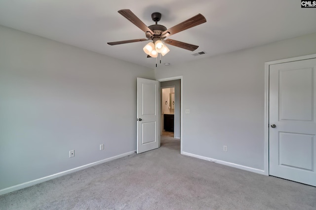 unfurnished bedroom featuring visible vents, carpet flooring, a ceiling fan, and baseboards