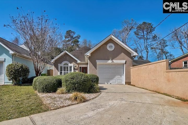 ranch-style house with stucco siding, driveway, and an attached garage