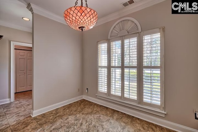 unfurnished room featuring crown molding, baseboards, and visible vents