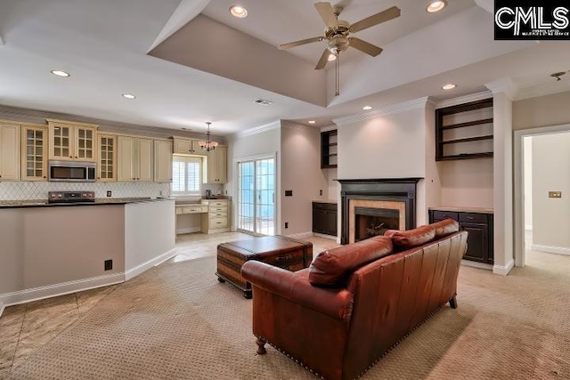 living room featuring ornamental molding, recessed lighting, a fireplace, baseboards, and ceiling fan