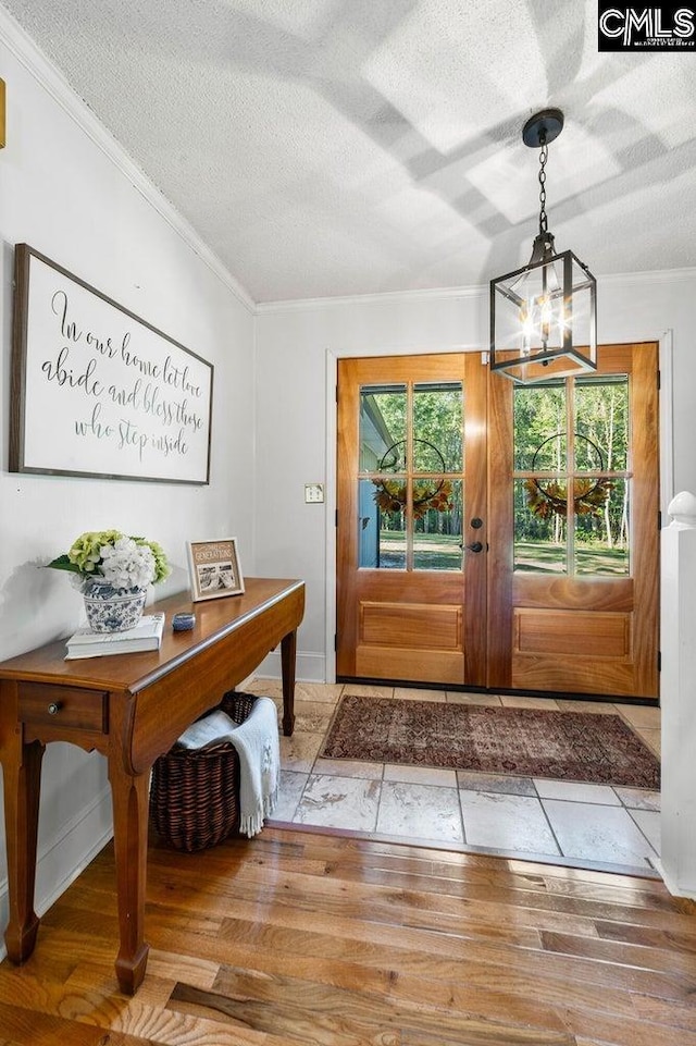164 Carriageton Dr, Orangeburg, SC 29115 - entryway featuring an inviting chandelier, plenty of natural light, wood finished floors, and ornamental molding