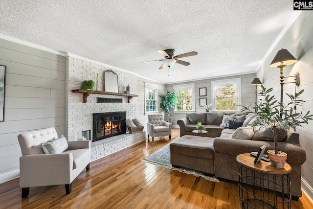 164 Carriageton Dr, Orangeburg, SC 29115 - living area with hardwood / wood-style floors, crown molding, a brick fireplace, and ceiling fan