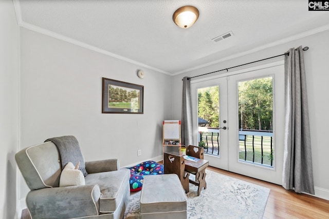 164 Carriageton Dr, Orangeburg, SC 29115 - sitting room with visible vents, french doors, crown molding, and wood finished floors