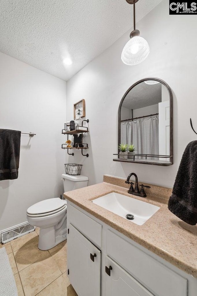 164 Carriageton Dr, Orangeburg, SC 29115 - full bathroom featuring visible vents, toilet, vanity, tile patterned floors, and a textured ceiling