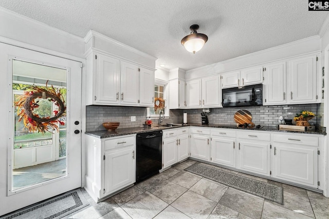 164 Carriageton Dr, Orangeburg, SC 29115 - kitchen with decorative backsplash, black appliances, white cabinets, and a sink