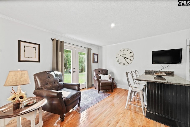 164 Carriageton Dr, Orangeburg, SC 29115 - living area featuring baseboards, light wood-style floors, crown molding, and a textured ceiling