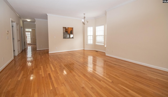 interior space with baseboards, an inviting chandelier, and light wood finished floors