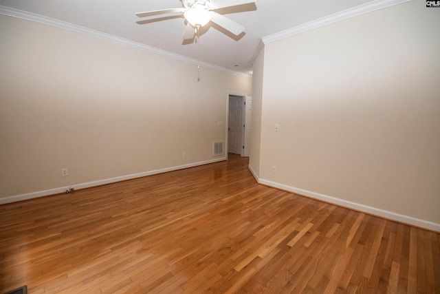 spare room featuring visible vents, baseboards, and light wood-style flooring