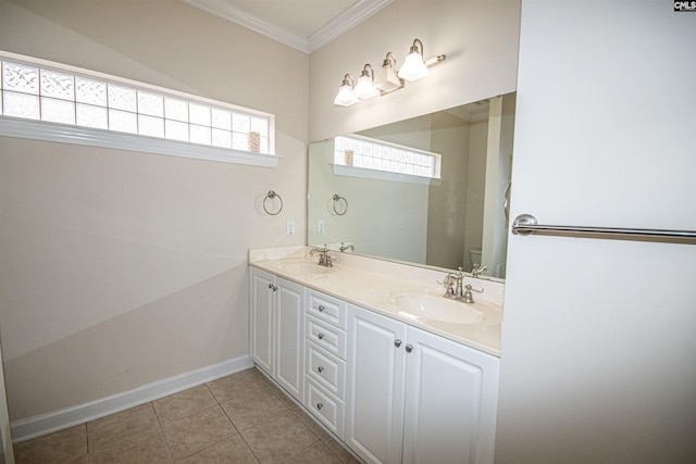 bathroom with a sink, toilet, ornamental molding, and tile patterned flooring