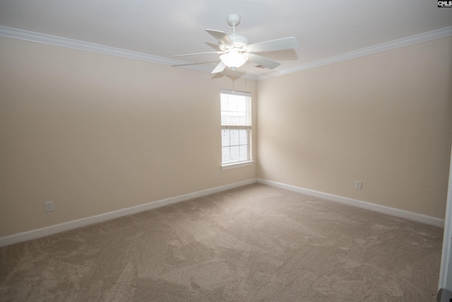 unfurnished room with light carpet, baseboards, a ceiling fan, and ornamental molding