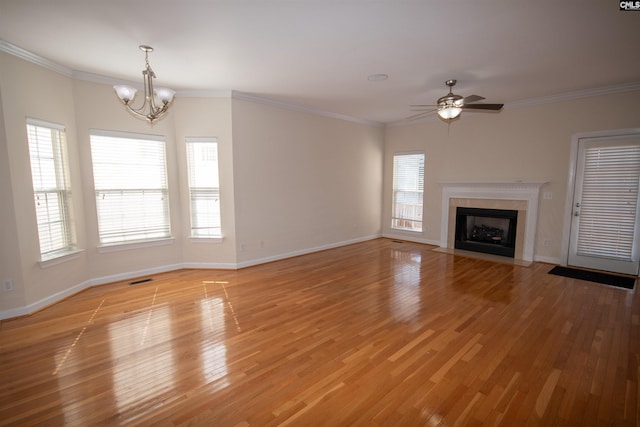 1208 Botanical Pkwy, West Columbia, SC 29169 - unfurnished living room with a chandelier, a ceiling fan, a fireplace with flush hearth, light wood-style floors, and crown molding