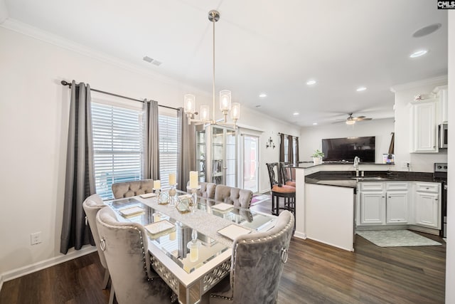dining room with visible vents, plenty of natural light, and dark wood-type flooring