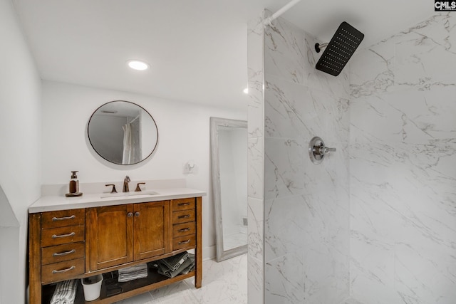 bathroom featuring vanity, recessed lighting, marble finish floor, and a marble finish shower