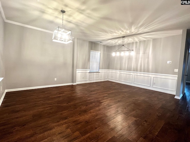 526 Eagles Rest Dr, Chapin, SC 29036 - unfurnished dining area with crown molding, a decorative wall, and dark wood-style flooring