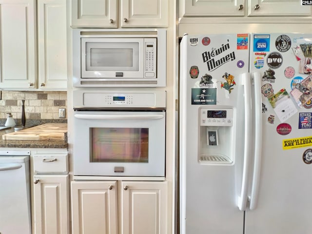 541 Georgia St, Columbia, SC 29201 - kitchen featuring tasteful backsplash, white cabinets, and white appliances