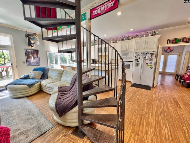 541 Georgia St, Columbia, SC 29201 - stairway featuring recessed lighting, wood finished floors, and ornamental molding