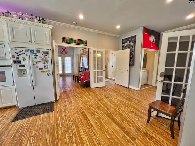 541 Georgia St, Columbia, SC 29201 - kitchen featuring recessed lighting, french doors, white appliances, light wood-style floors, and crown molding
