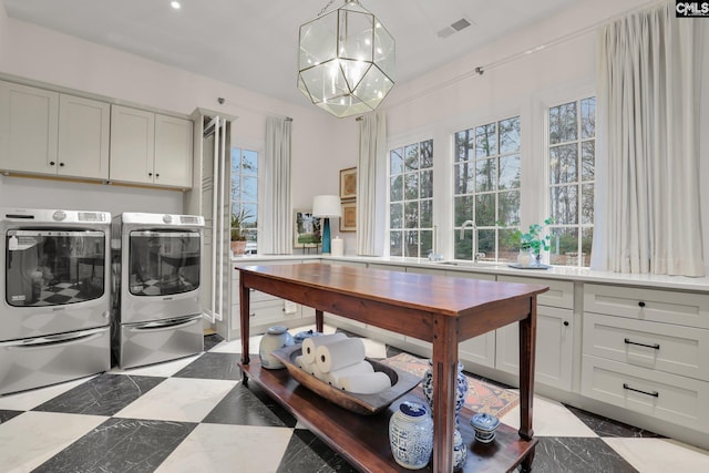 536 Yachting Rd, Lexington, SC 29072 - laundry area with visible vents, a chandelier, washing machine and dryer, cabinet space, and a sink