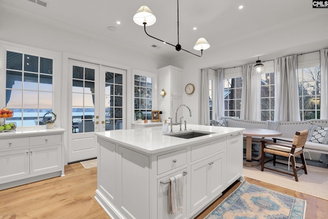 536 Yachting Rd, Lexington, SC 29072 - kitchen featuring recessed lighting, a kitchen island with sink, a sink, light wood-style floors, and white cabinetry
